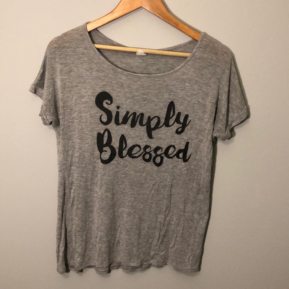 Grey shirt that’s says “Simply Blessed”